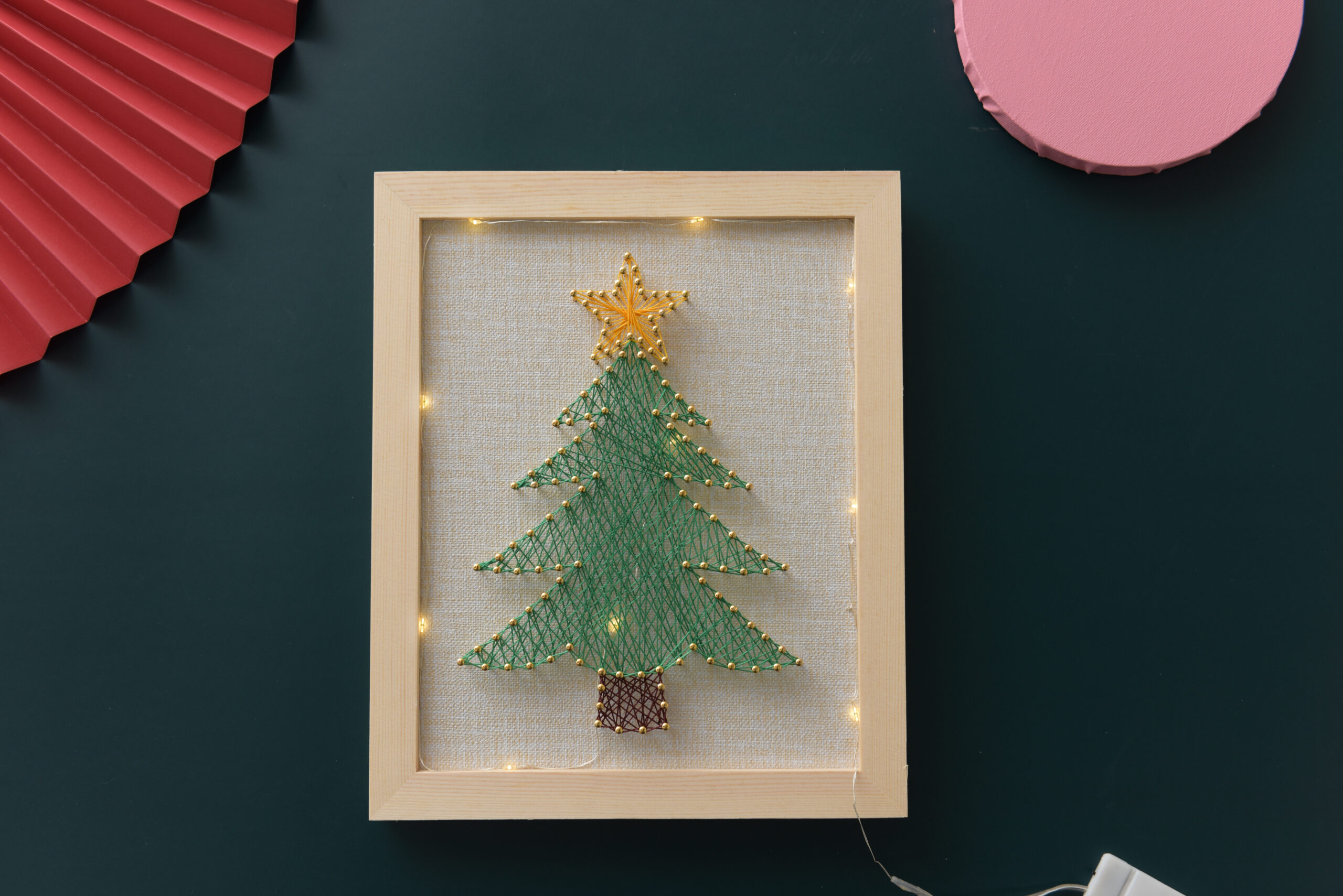 Christmas tree string art with golden star and LED lights