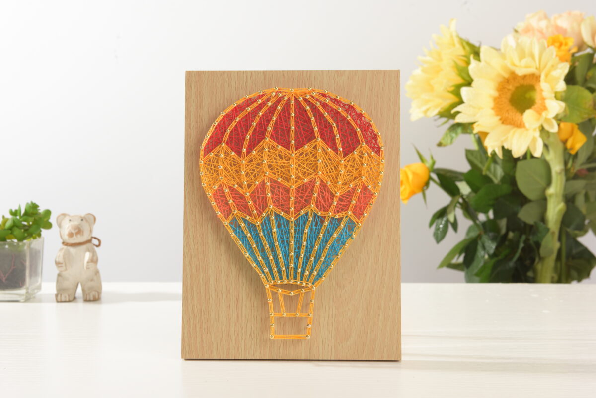 whimsical hot air balloon string art for kids room