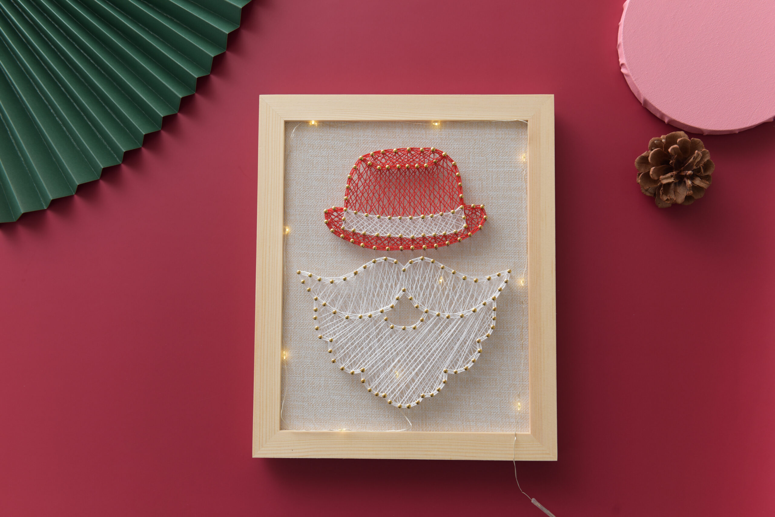 Santa Claus string art with red hat and white beard